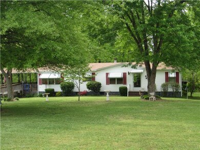 DOUBLEWIDE HOUSE SITS AT VERY BACK OF PROPERTY WITH BEAUTIFUL VIEWS OF PROPERTY