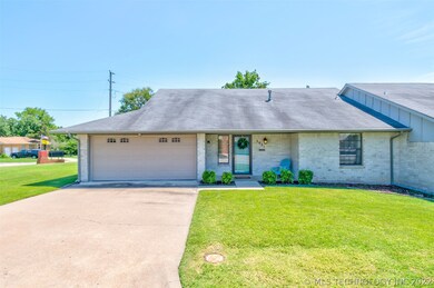 Front view. Full brick with covered front porch. Lot to the left is included in price of home.