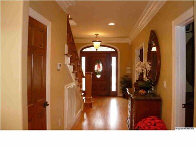 As you enter this home you will notice the gleaming hardwoods, smooth ceilings & crown molding.
