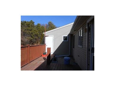 Exterior Back. Deck Looking toward Storage Area