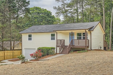 Single story home with a garage, roof with shingle