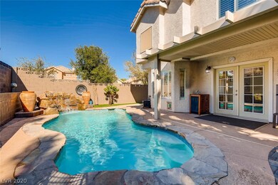 Water fall and patio doors entering the pool area