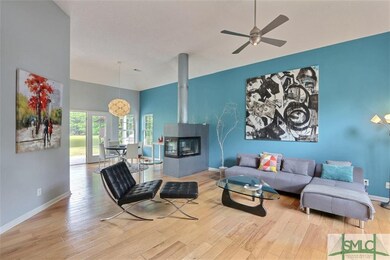 Flowing Natural wood floors flow throughout this h