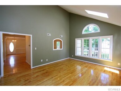The living room also features a pass-through windo