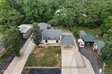 Aerial view featuring a view of trees