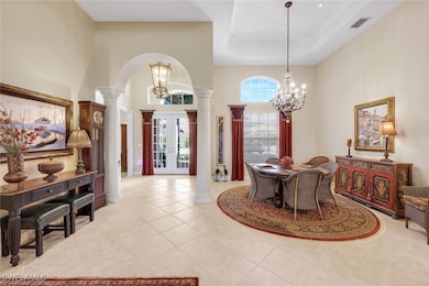 Enter into the formal living/dining area where you will find volume ceilings, pool views and ample space for special gatherings.