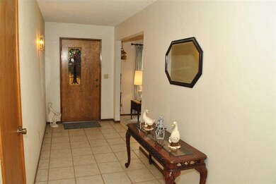 Entry Hall is wide and roomy, with newer tile floo