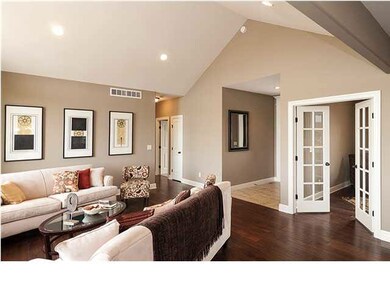 Vaulted cathedral ceiling in living area. Glass do