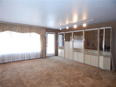 The huge window in the family room shines through 
