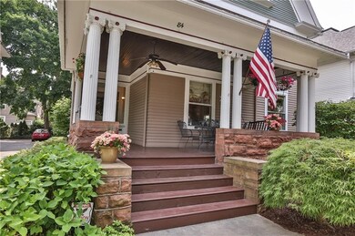 Massive sandstone masonry and Ionic columns form a
