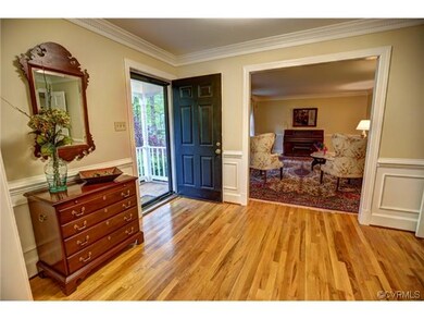 Large center hall foyer with gleaming wood floors 