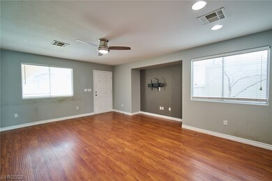 Living room with wood look laminate flooring, desi
