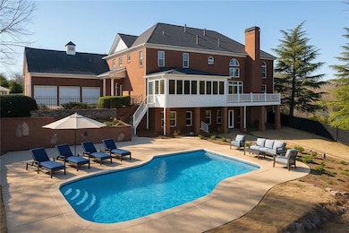 Pool - staged to reflect how the pool may look when uncovered. Sellers will open the pool during the buyers due diligence for inspections, etc.