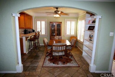 Dining room entry with pretty archway and columns.
