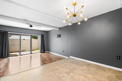 Unfurnished room with an inviting chandelier, a te