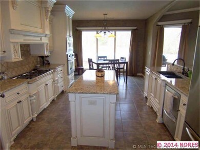 This view of the kitchen shows the center island a