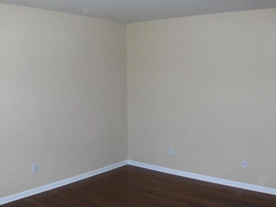 Cozy living area with hardwood floors.
