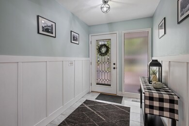 Bright Updated Entryway with Marble Tile