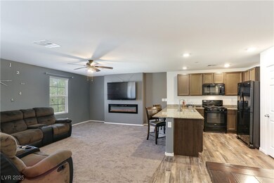 Kitchen featuring open floor plan, a peninsula, bl