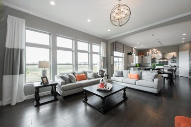 A tall wall of windows brings in lots of warm natural light to the main living area!