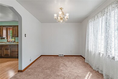 Well lit dining room opens to kitchen.