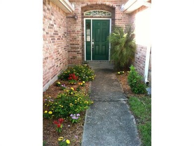 Photo. Front Entrance with Fresh Flower Bed