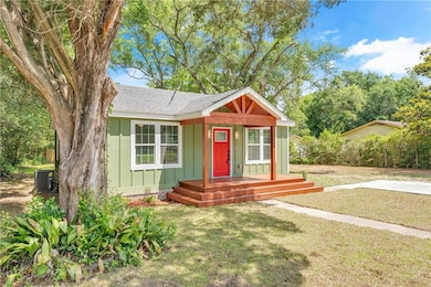 Bungalow featuring board and batten siding, a shin