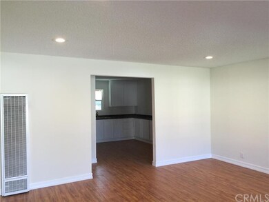 New laminate flooring, recessed lighting and fresh