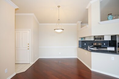 Front door with dining room right off of the kitchen.