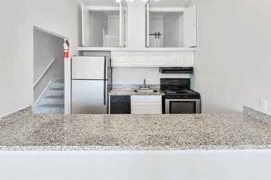 The kitchen space is open to the living area which