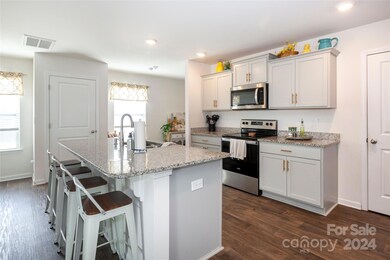 Beautiful kitchen with updated hardware, granite countertops and stainless appliances