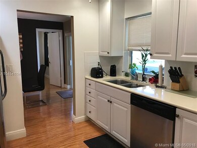upgraded kitchen with pass thru window to patio