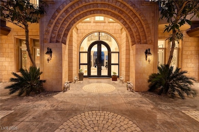 Property entrance featuring french doors