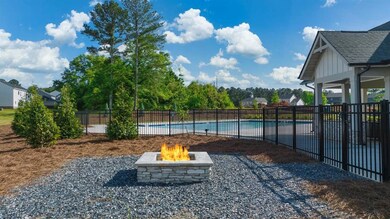 View of yard with a fenced in pool and an outdoor 
