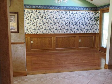 Across from the kitchen is the dining room with pl