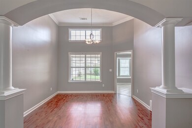 Featuring 10 ft ceiling with custom crown molding.