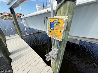 Dock with a water view and boat lift