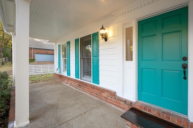 Property entrance featuring covered porch