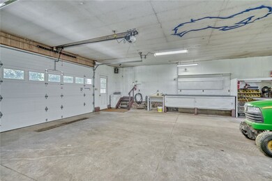 Spacious garage/shop with overhead door access on