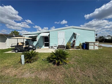 View of front of house featuring a carport and a f