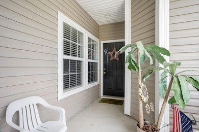 View of exterior entry featuring a porch