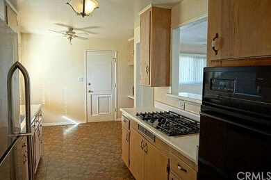 Clean kitchen, eating area, exit to side yard