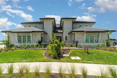 View of front facade featuring stucco siding, a fr