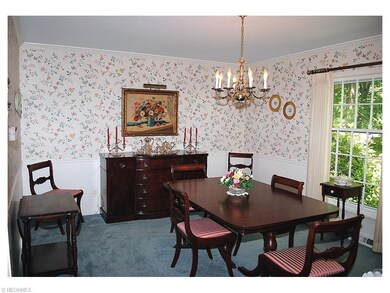 FORMAL DINING ROOM WITH CHAIR RAIL, CHANDELIER AND