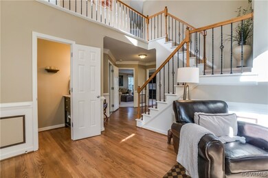 Another view of the foyer with 1/2 bathroom