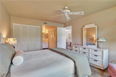 Main Bedroom with ceiling fan, and vinyl wood look