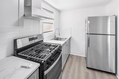 This photo showcases a modern, compact kitchen wit