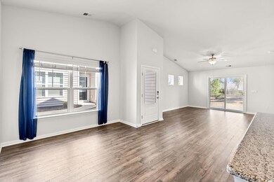 Unfurnished living room with visible vents, basebo