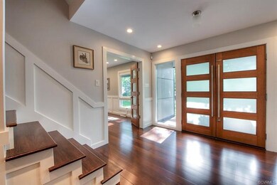 Another view of the foyer with hardwood floors tha