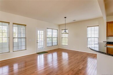 Morning sun filters into the kitchen dining area l